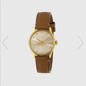 Brand new Gucci G-timeless watch still in original packaging. $1400 value.